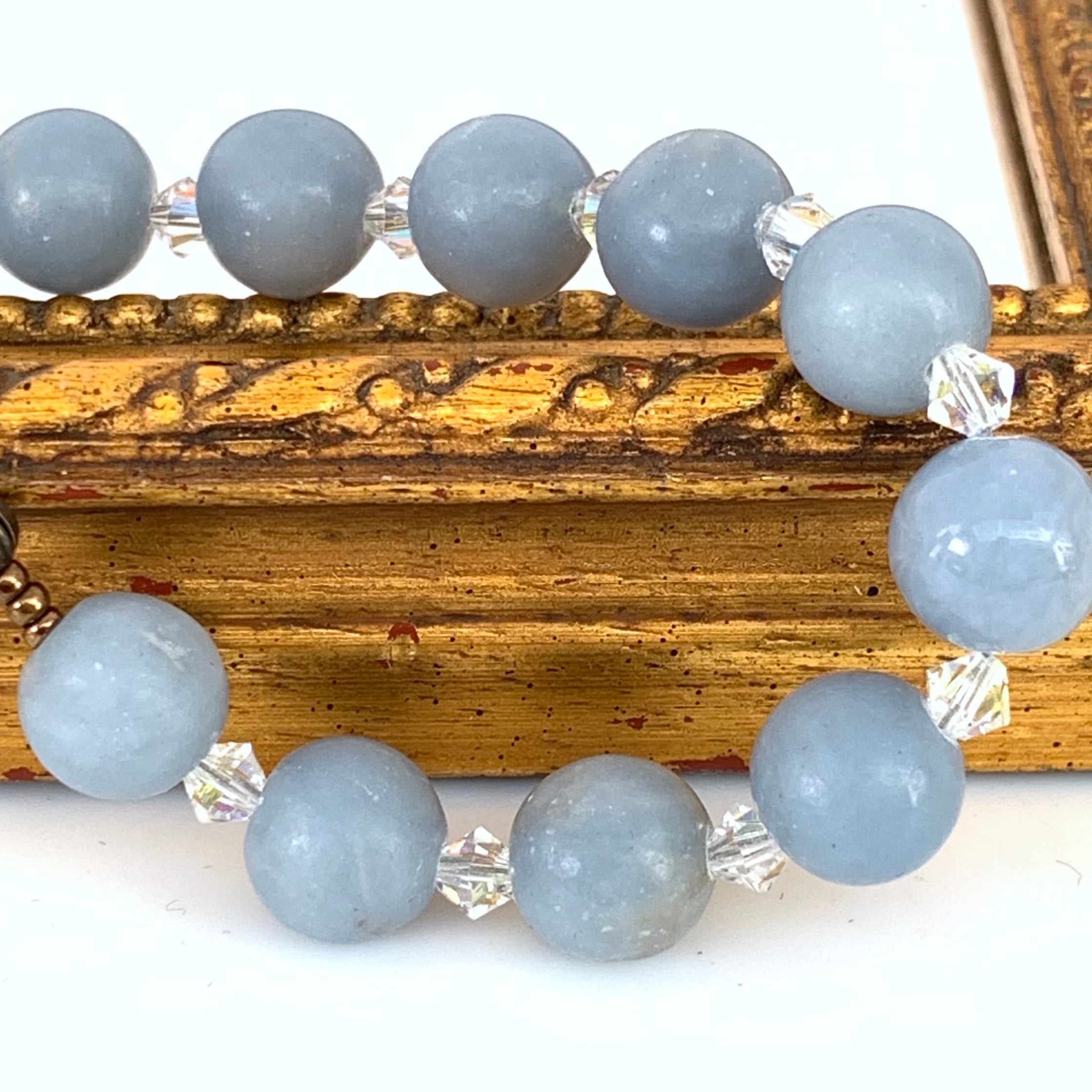 Angelite or angel stone rosary beads with Swarovski spacer crystals.