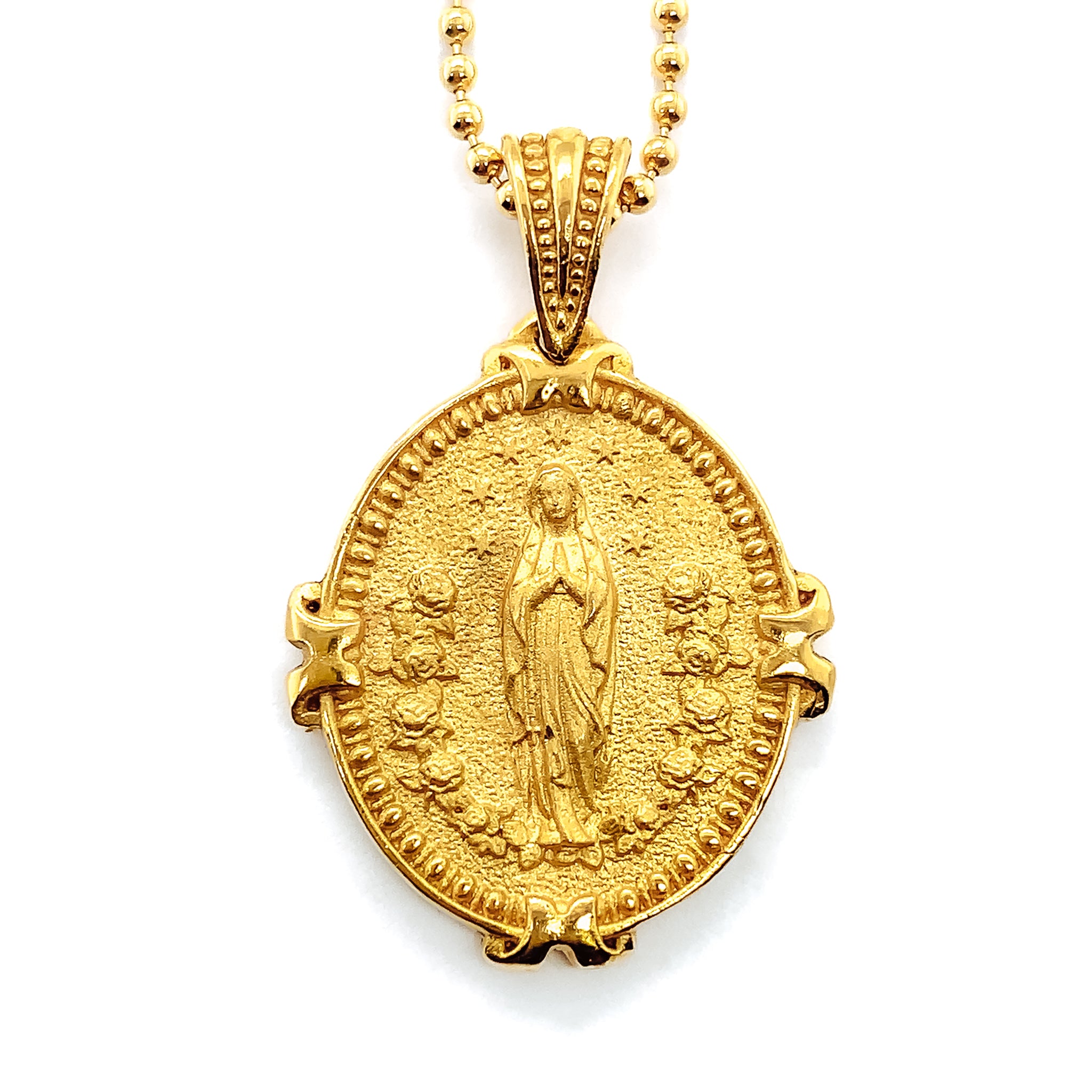 Gold necklace pendant with our lady of lourdes. The pendant is hung from a gold bead chain. The reverse side of the pendant contains an image of Mary's Auspice Maria emblem with her crown indicating she is Queen of Heaven. Ave Maria Necklace.