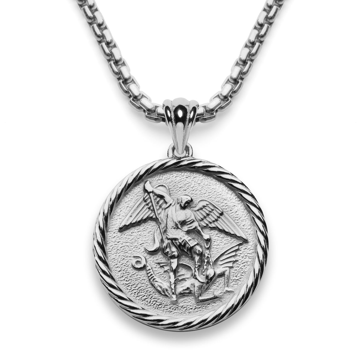 A pendant featuring St Michael the archangel with his foot on a demon and his sword poised to strike. The round sterling silver pendant is hung on a silver chain. The pendant has a rope like border around the edge.