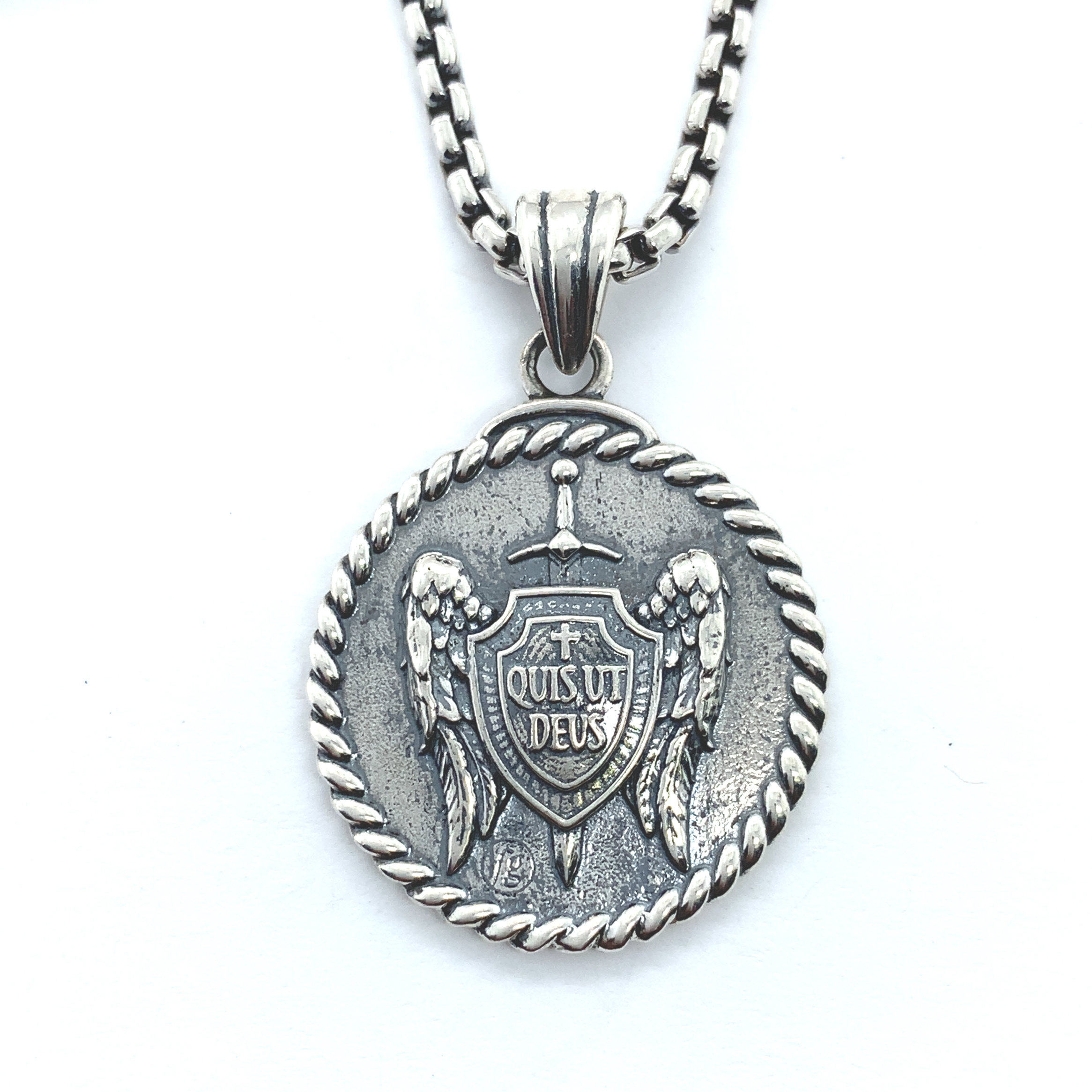 Necklace pendant of St Michael's shield and sword in sterling silver. Round pendant has a rope border.