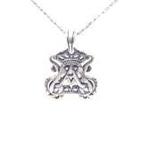 large silver pendant on silver chain featuring openwork auspice maria insignia
