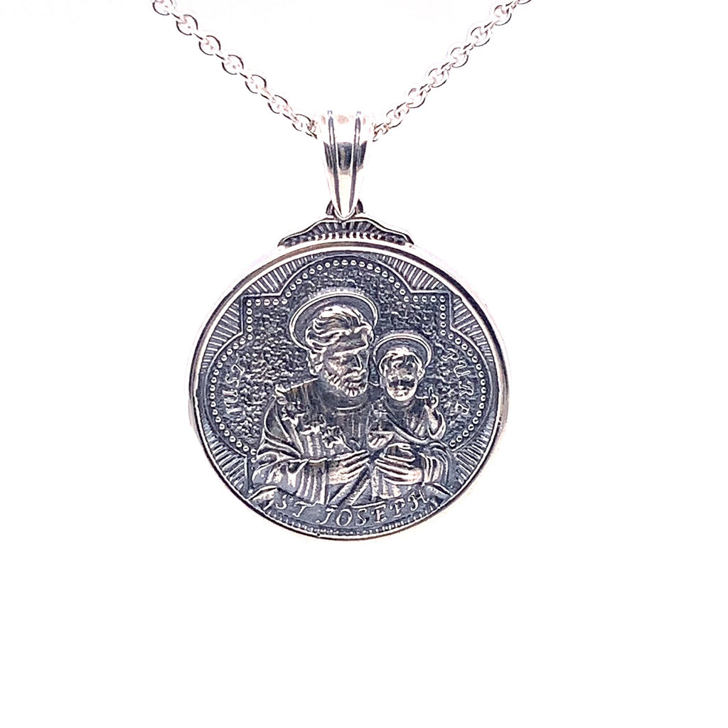 Rotating view of sterling silver pendant with St Joseph and 3 hearts