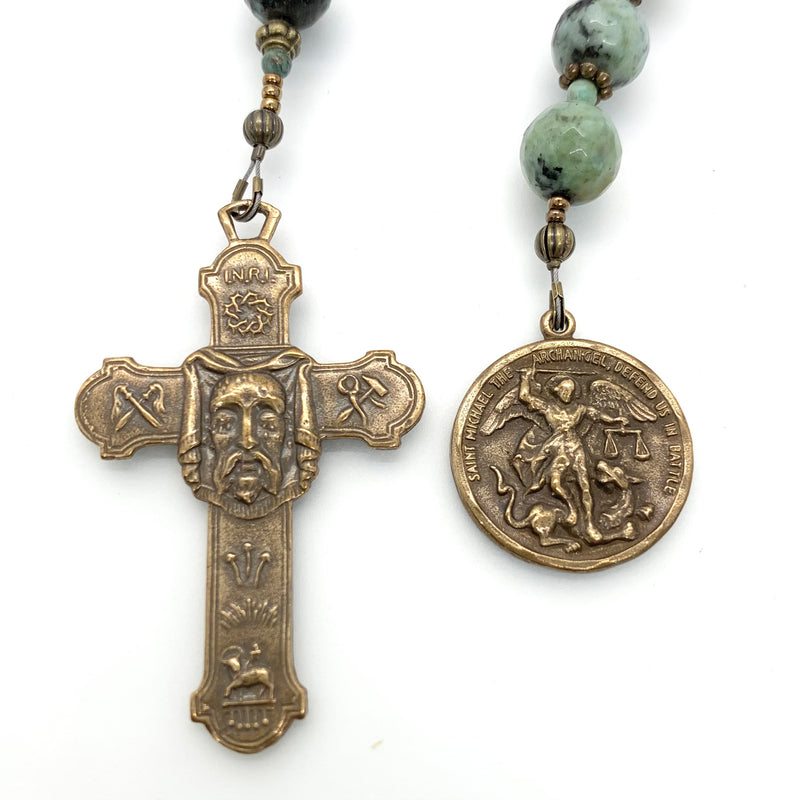 Single decade rosary with african turquoise beads, a holy face cross and St Michael medal both in bronze.