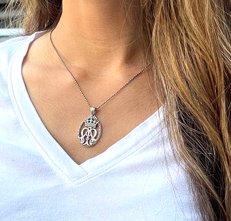 Silver openwork pendant of auspice maria symbol on silver chain