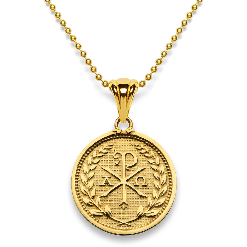Gold pendant on a gold bead chain displaying the Chi and Rho letters accompanied by the alpha and omega letters.  The round pendant design is bordered by leaves on stems around the perimeter.