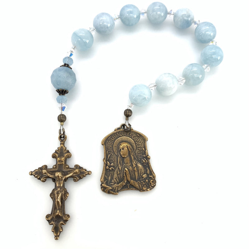 Aquamarine beads on one decade rosary with bronze lourdes medal and crucifix