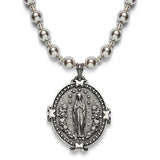 A pendant of Our Lady of Lourdes on one side and Auspice Maria emblem on the reverse in Sterling Silver