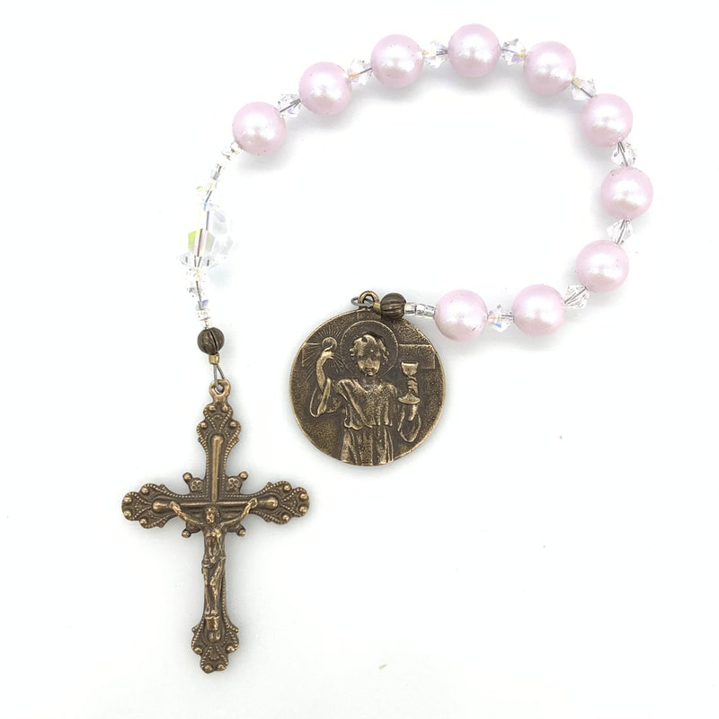 Rose Swarovski beads with crystal spacers and young jesus medal form this beautiful single decade rosary.  Perfect for girls.