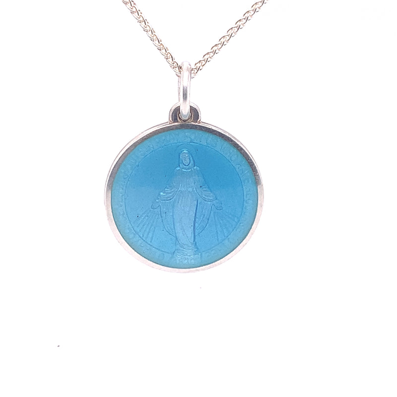 A sterling silver Miraculous Medal showing our lady in light blue enamel hanging on a silver chain