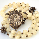 Yellow calcite bead rosary with bronze fatima center and bronze rose our father beads